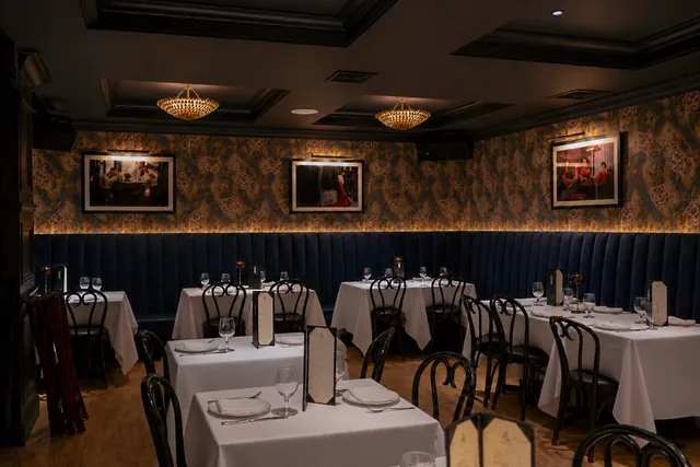 The main dining room prepared for service at Sei Less