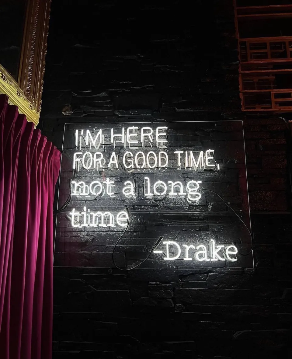 The Drake quote in neon inside Sei Less