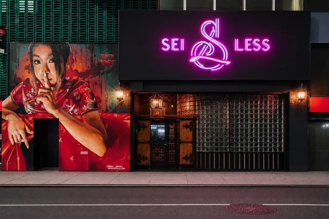 The Sei Less entrance mural and illuminated sign on West 38th Street